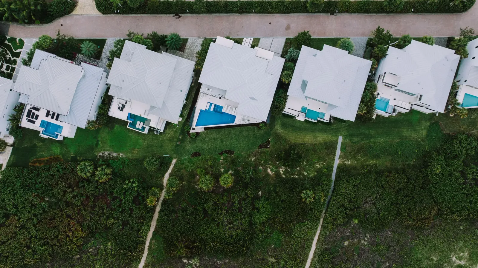 Aerial view of a newly built Florida community with pools
