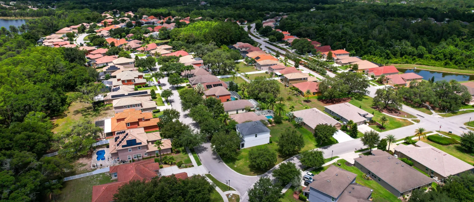 Aerial view of a Florida residential community surrounded by trees